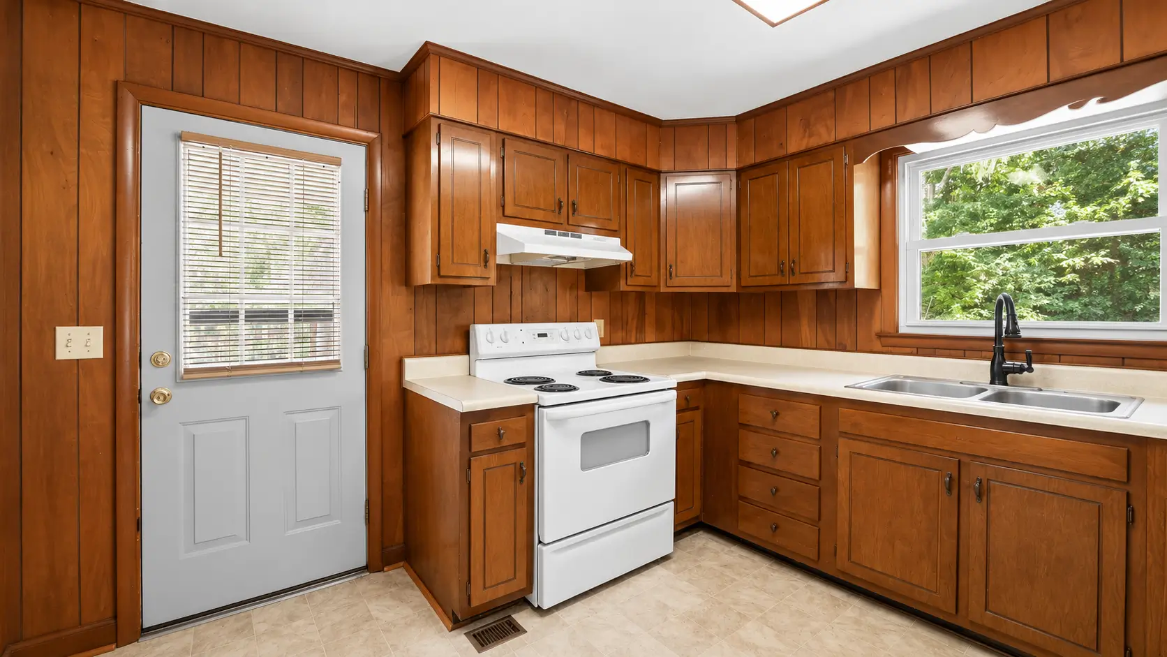 Dated 1980s kitchen before renovation in a Beaufort County fix-and-flip investment property